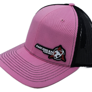 Side view of the Best Hat You Will Ever Own pink and black American Animal Arms trucker hat with PVC patch mounted on the lower left hand side of the hat.